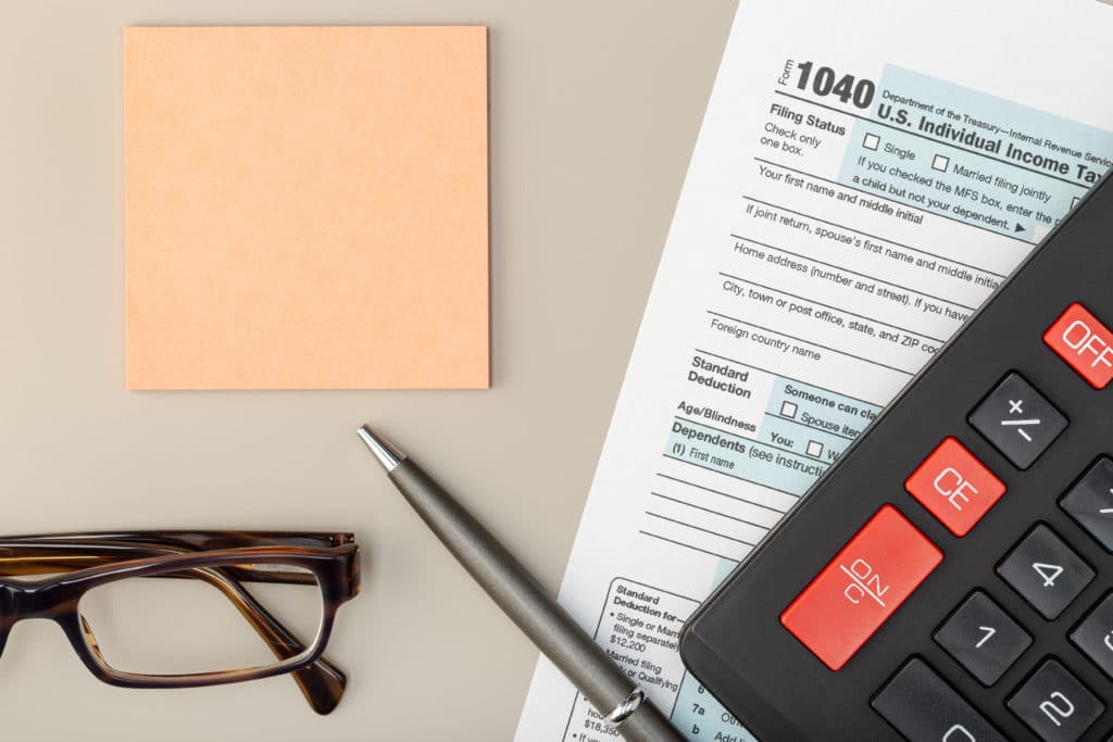 Individual Tax Return Form on table. Tax time concept. Top view Mock up