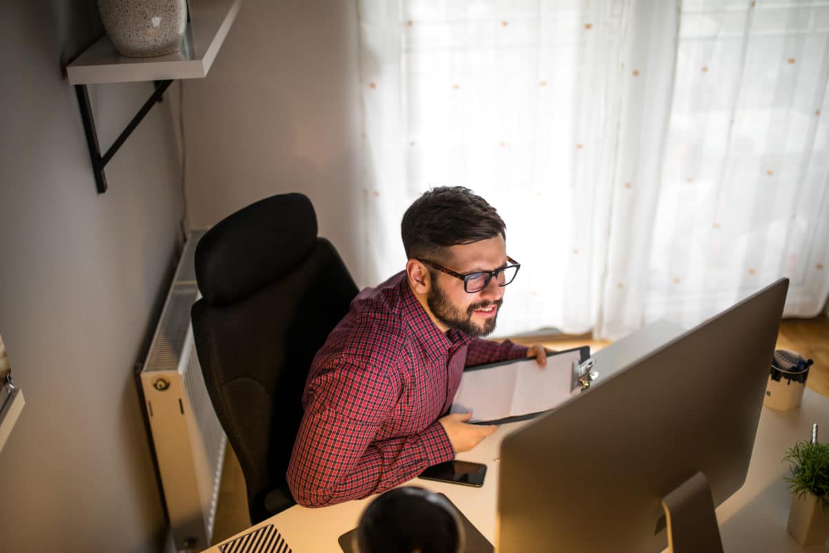 Handsome businessman working with documents on his desk.
